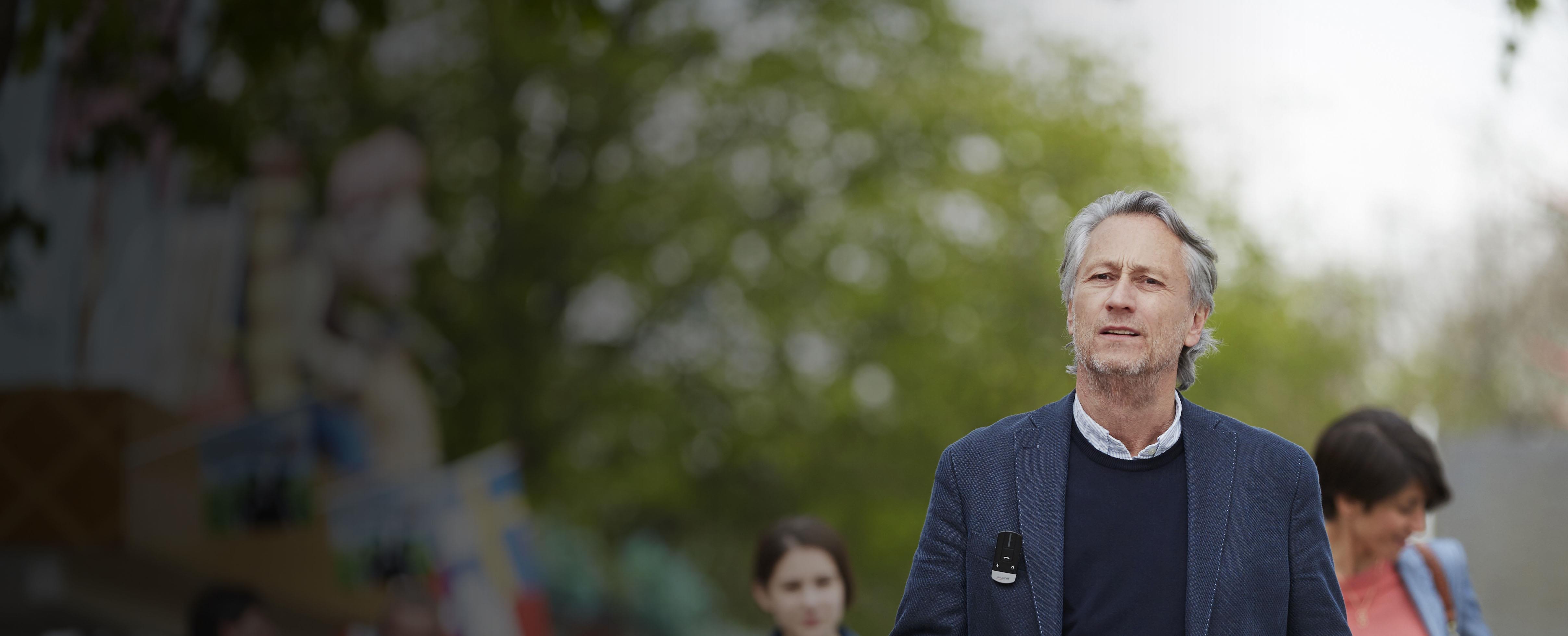 Man using the ReSound Phone Clip+.