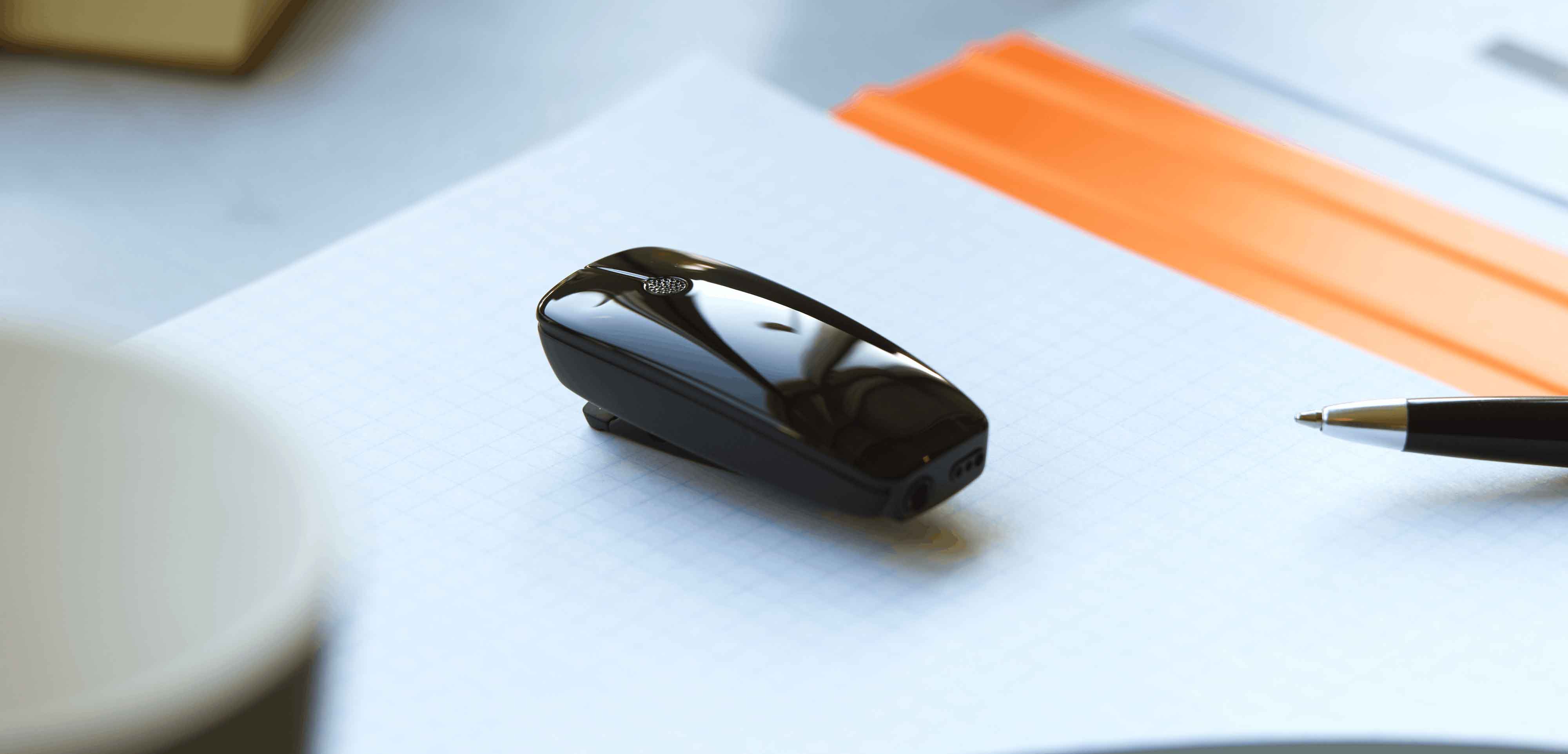 ReSound Micro Mic hearing aid accessory on a table. 