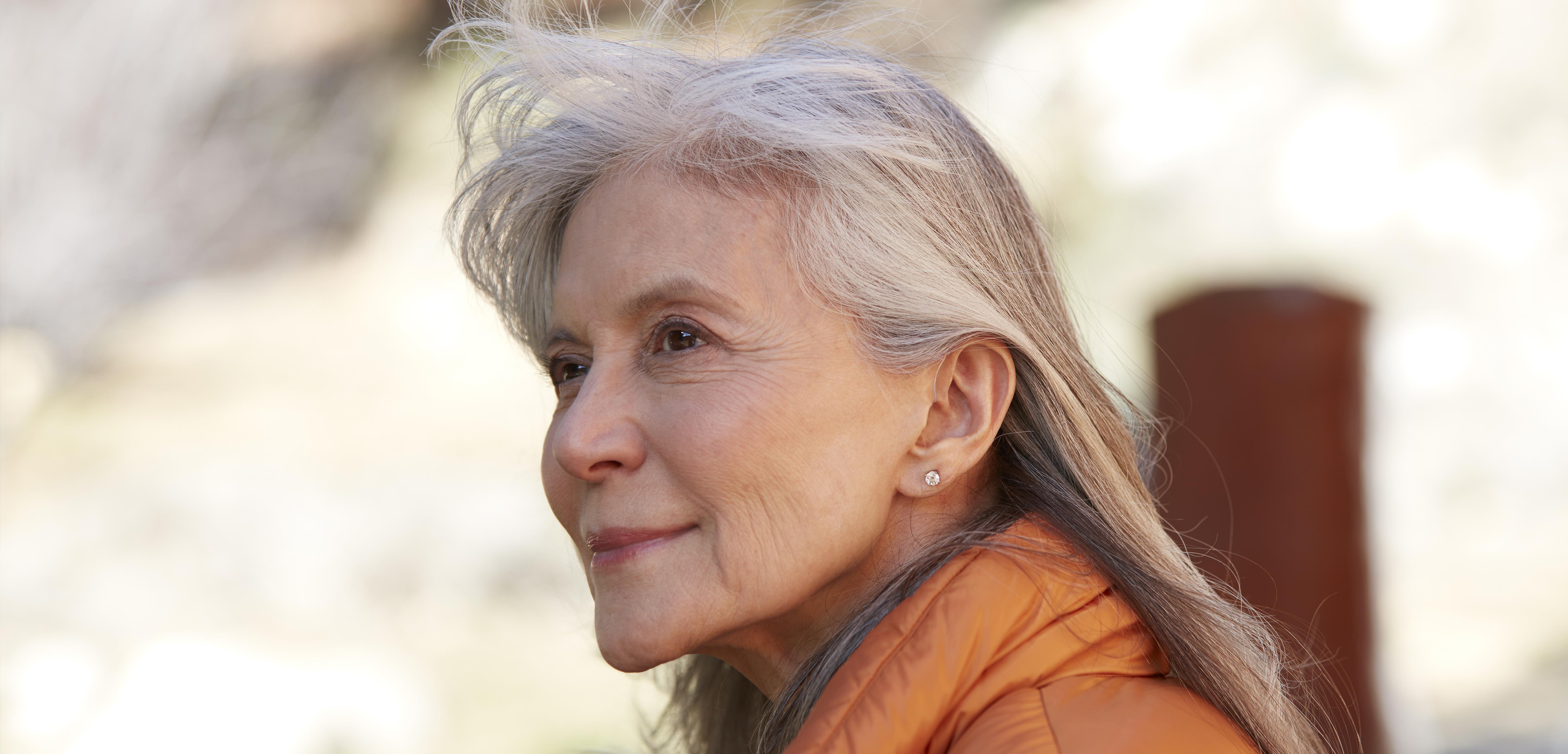 Woman wearing ReSound hearing aids.