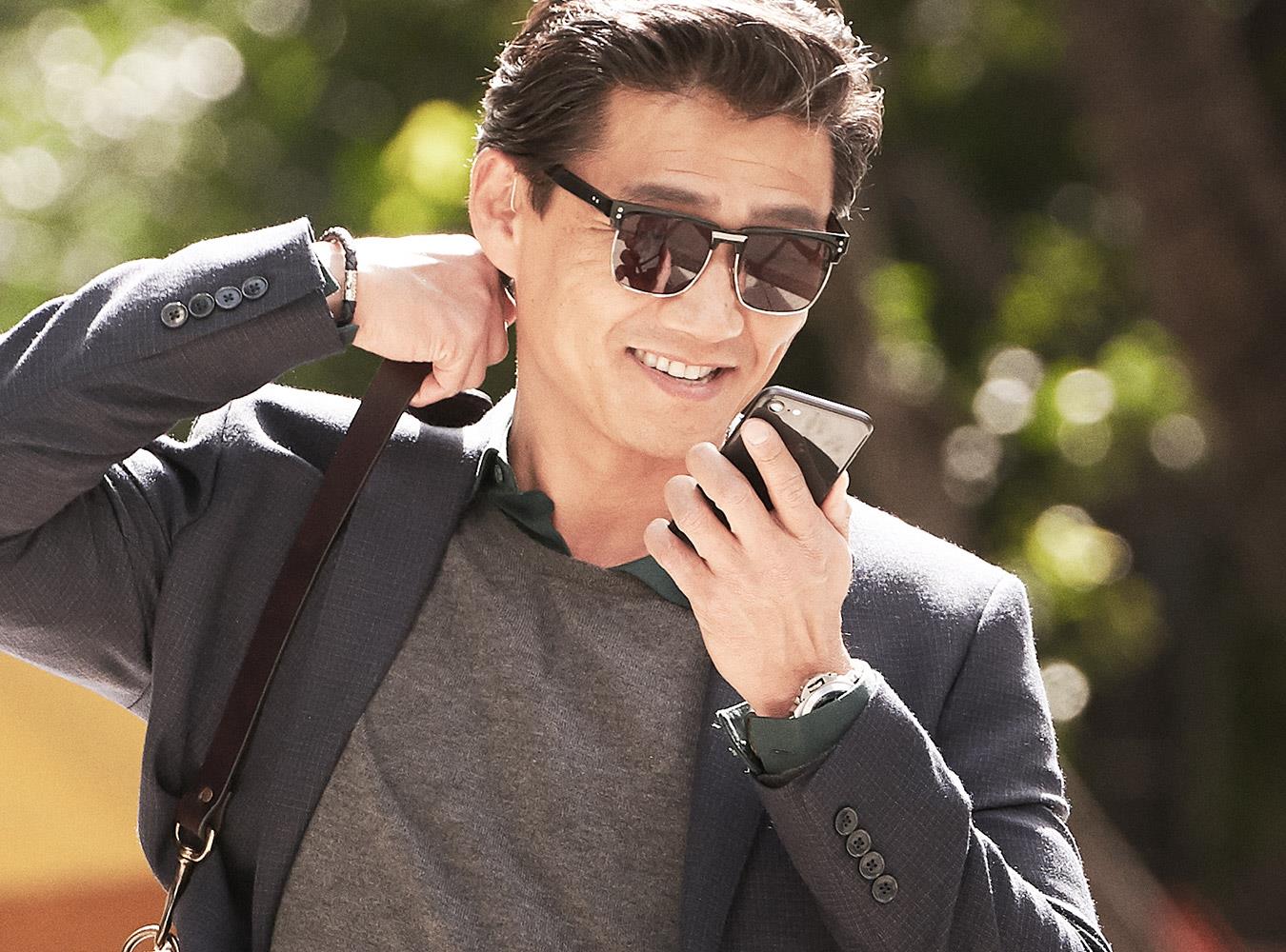 Man enjoys the exceptional sound quality from LiNX Quattro when streaming from his audio devices. 