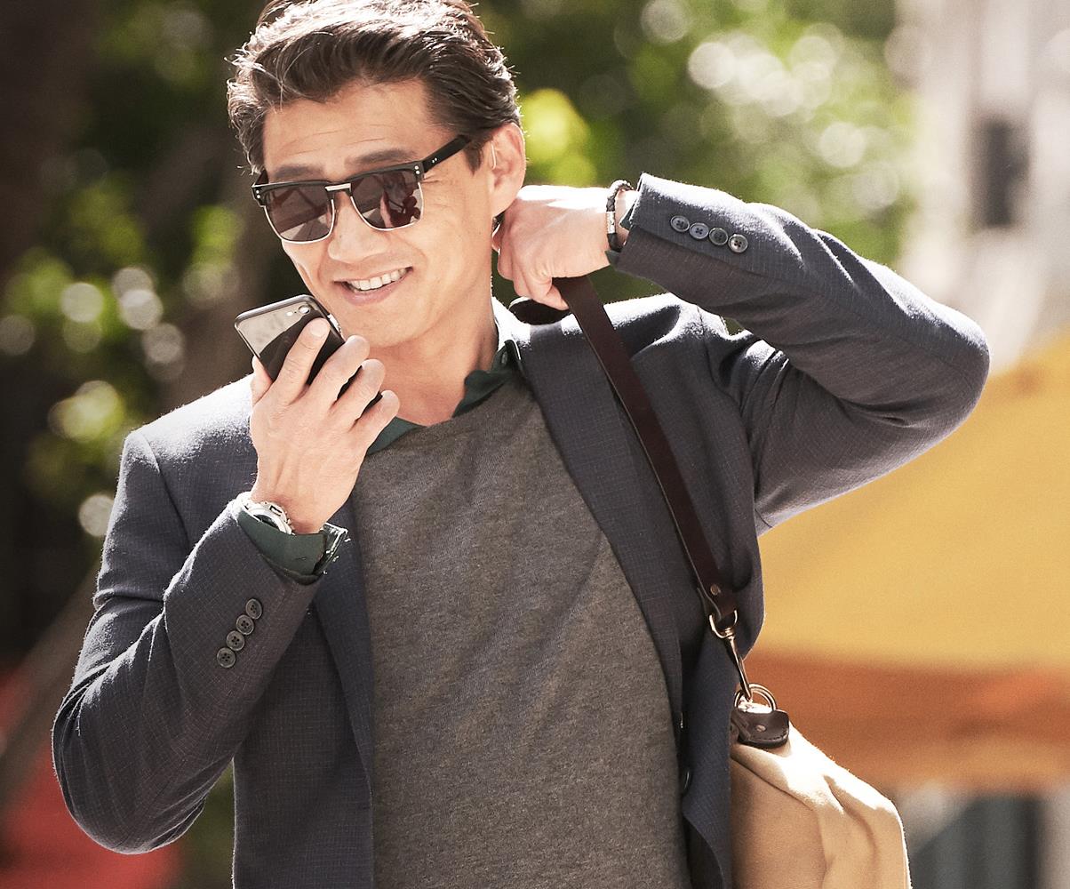 Man enjoys the exceptional sound quality from LiNX Quattro when streaming from his audio devices. 