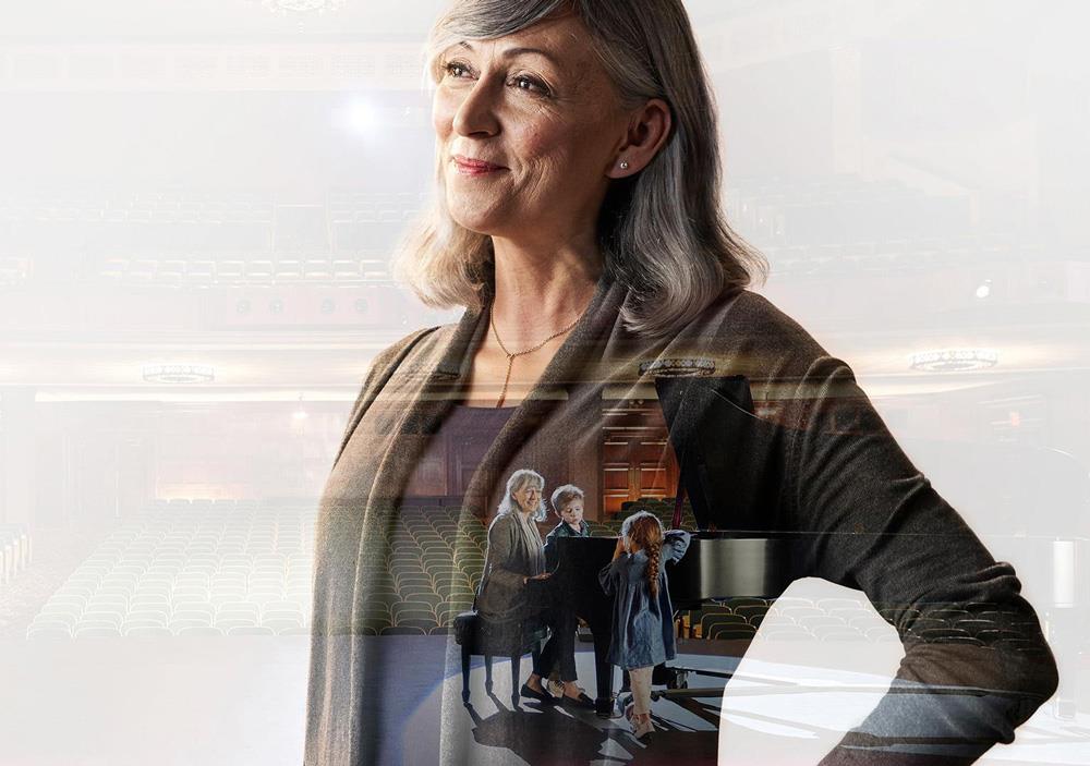 Woman playing piano with grandkid wearing LiNX Quattro hearing aids