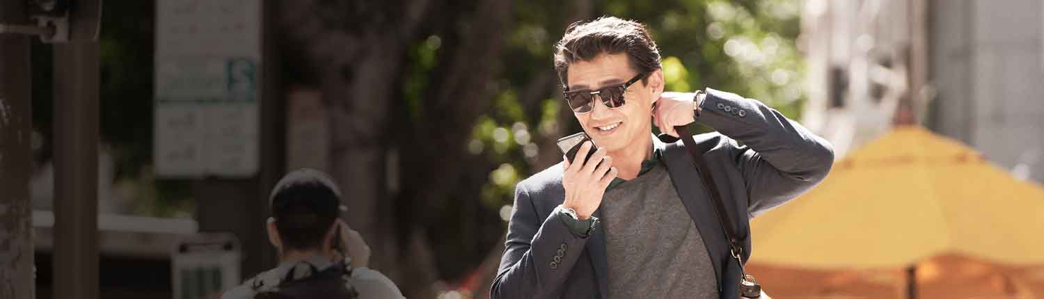 Happy man streams music and phone calls directly to LiNX Quattro rechargeable hearing aids